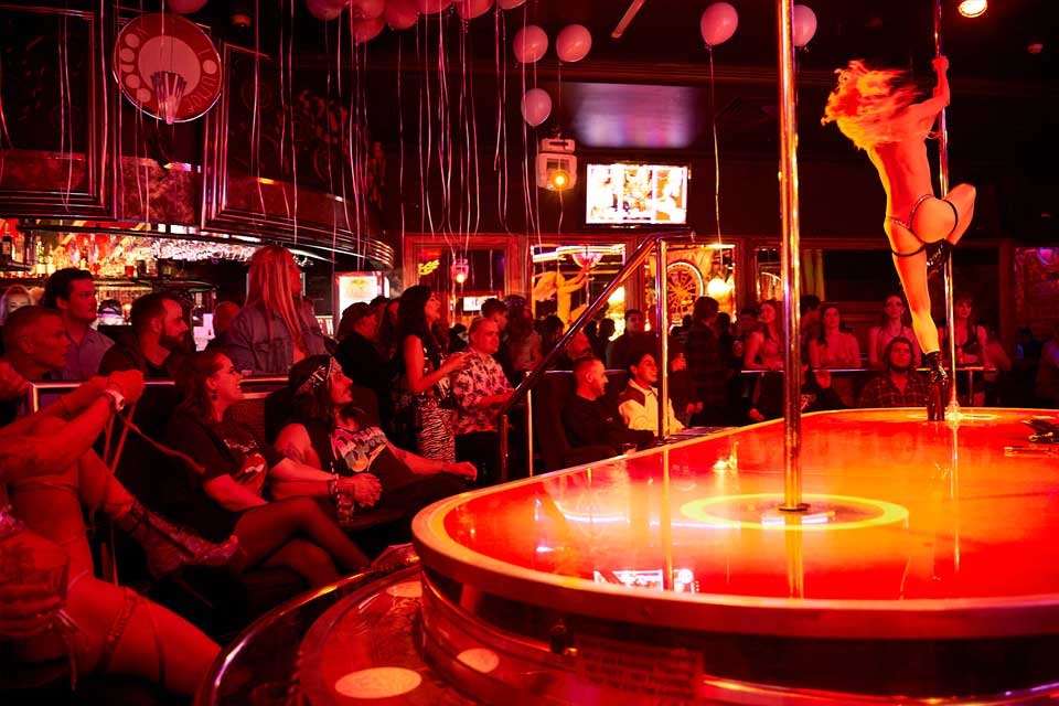 Voodoo Lounge crowd watching pole dancer